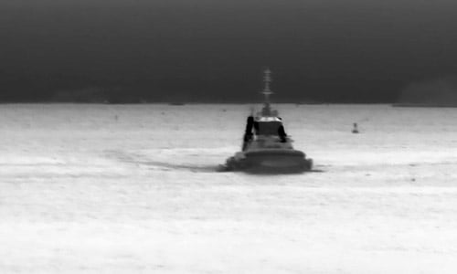 Tugboat approaching in thermal